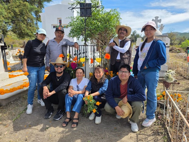 Emanuel’s siblings and their families around the tomb of Melquiades Cruz